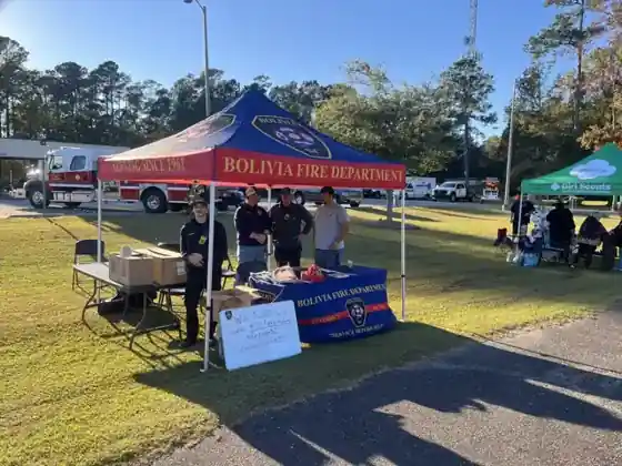 Custom Bolivia Fire Department canopy tent with printed table cover